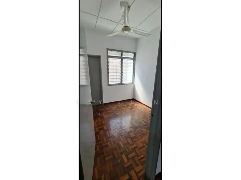Room features: wooden flooring, white painted walls, ceiling fan, large window with grid pattern, door leading to another room, natural light from window.
