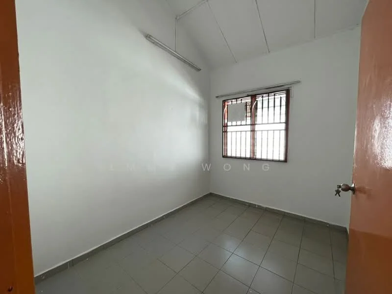 Room features: white painted walls, grey tiled flooring, single window with metal grille, ceiling light fixture, sliding door, high ceiling.