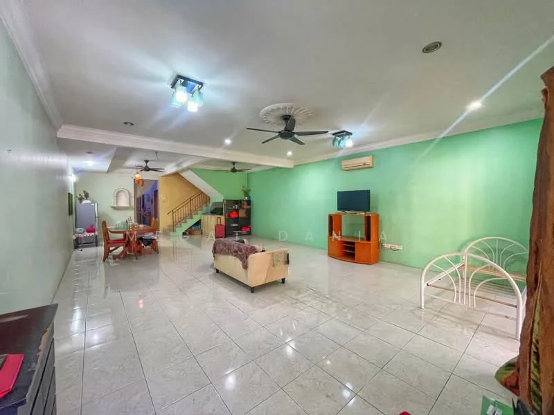 Living features: green painted walls, glossy white tile flooring, 2 ceiling fans, recessed downlights, sofa in beige, coffee table, TV console, wall-mounted TV, decorative wooden feature, staircase in background, open layout, area rug; style: modern.