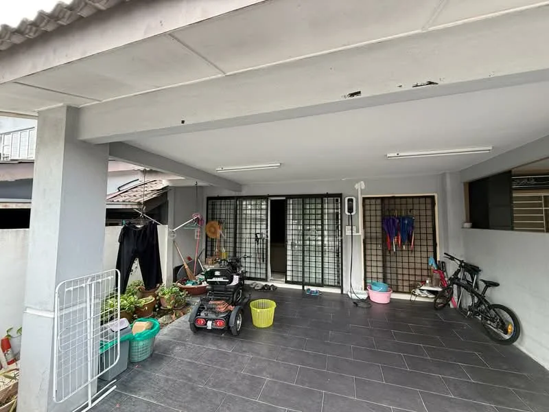 Exterior type: linked terrace house; features: covered porch area, grey tiled flooring, metal grilles on doors, potted plants, clothes drying rack, bicycle, plastic storage bins, outdoor lighting, two ceiling lights; style: modern.