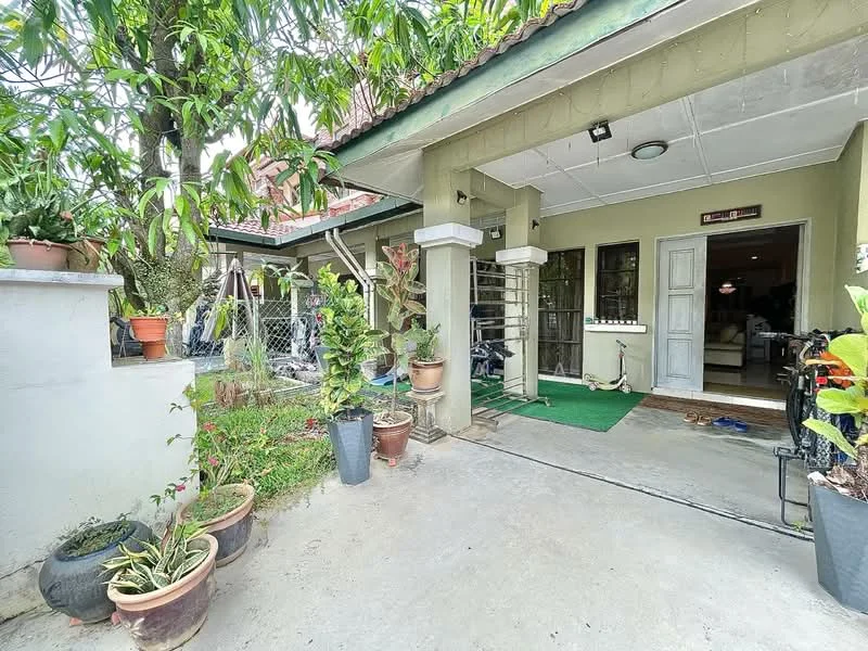 Exterior type: detached bungalow; features: green lawn, potted plants, stone pathway, covered porch, fenced yard, single-storey, gabled roof, outdoor lighting, entrance door with sidelights; style: modern.