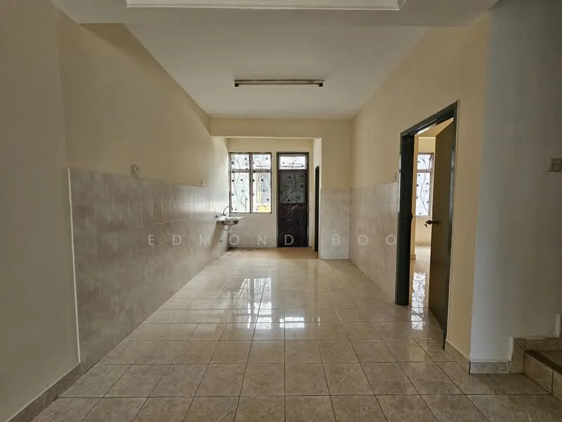 Room features: cream painted walls, glossy ceramic tile flooring, single window with metal grille, door with decorative glass panel, wall-mounted sink, ceiling light fixture, neutral color scheme, open layout; style: modern.