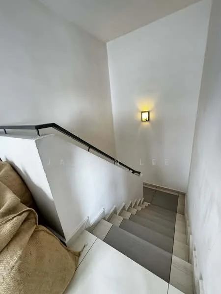 Room features: white painted walls, staircase with tiled steps, metal handrail, wall-mounted light fixture, neutral flooring, textured wall, corner seating area with cushion; style: modern.