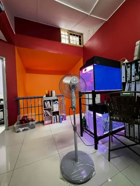 Room features: red painted walls, orange painted accent wall, white tiled flooring, standing fan, black shelving unit, aquarium with blue lighting, open shelving with books and files, window with grid pattern.