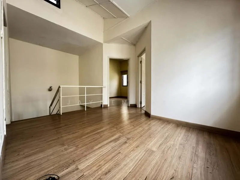 Room features: laminate flooring, white painted walls, ceiling with exposed beams, large window for natural light, doorway leading to another room, railings at a raised area, neutral color scheme, no visible furniture; style: modern.