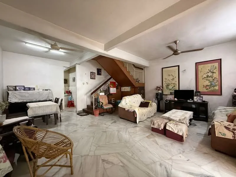 Living features: marble flooring, white painted walls, 5-blade ceiling fan, wall-mounted TV, two-seater fabric sofa, armchair with fabric upholstery, coffee table, decorative wall art, staircase leading to upper floor, potted plant, side table, textile throw covers on furniture; style: traditional.
