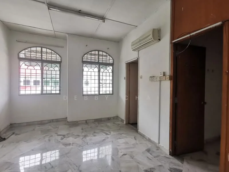 Room features: white painted walls, marble tile flooring, 2 floor-to-ceiling windows, 1 wall-mounted split AC, ceiling lights, doorway to adjacent room, door with handle, window grilles.