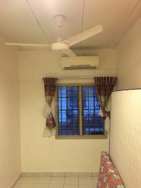 Room features: white painted walls, ceiling fan, wall-mounted split AC, window with grid bars, curtains with patterned design, tiled flooring, sofa with floral pattern, light-colored bedding.