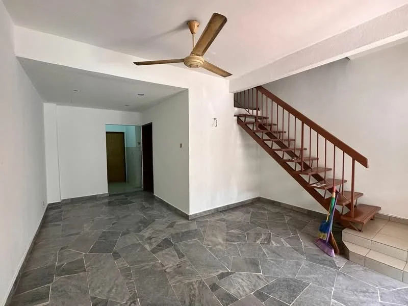 Living features: grey stone flooring, white painted walls, 5-blade ceiling fan, staircase with wooden railing, open layout, natural light from windows, no visible furniture, clean and uncluttered space; style: modern. Room features: doorway leading to another room, light fixture in ceiling.