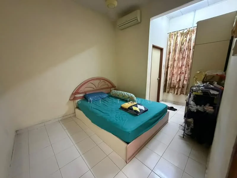 Bedroom features: queen-size bed with pink headboard, green bedspread, blue pillow, white walls, tile flooring, 1 wall-mounted split AC, curtains with floral pattern, built-in wardrobe, nightstand with items, door leading to hallway.