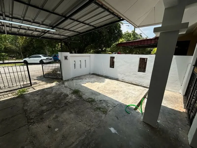 Exterior features: covered car porch, concrete flooring, white painted walls, metal gate, fenced perimeter, landscaped greenery, driveway, visible street view.
