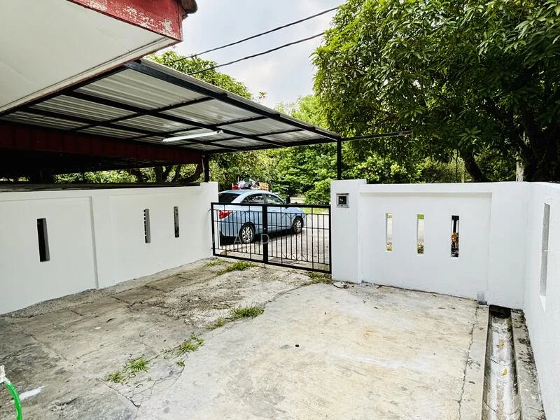 Exterior type: car porch; features: covered car porch, white painted walls, metal gate, concrete flooring, surrounded by greenery, driveway with gravel, mature trees; style: modern.