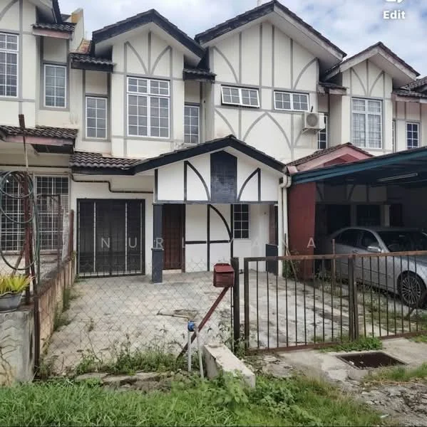 Exterior type: linked terrace house; features: white painted facade, timber cladding accents, gabled roof, single-storey, fenced front yard, paved driveway, car porch with awning, front garden with grass, multiple windows, air conditioning unit visible, main entrance door with decorative design; style: traditional.