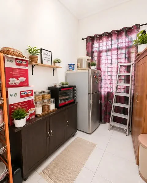 Kitchen features: white painted walls, glossy tile flooring, stainless-steel fridge, microwave, black countertop microwave oven, wooden cabinet with storage, open shelving with jars, ladder, curtains with floral pattern, potted plants, rug, kitchen appliances, decorative wall art; style: modern.