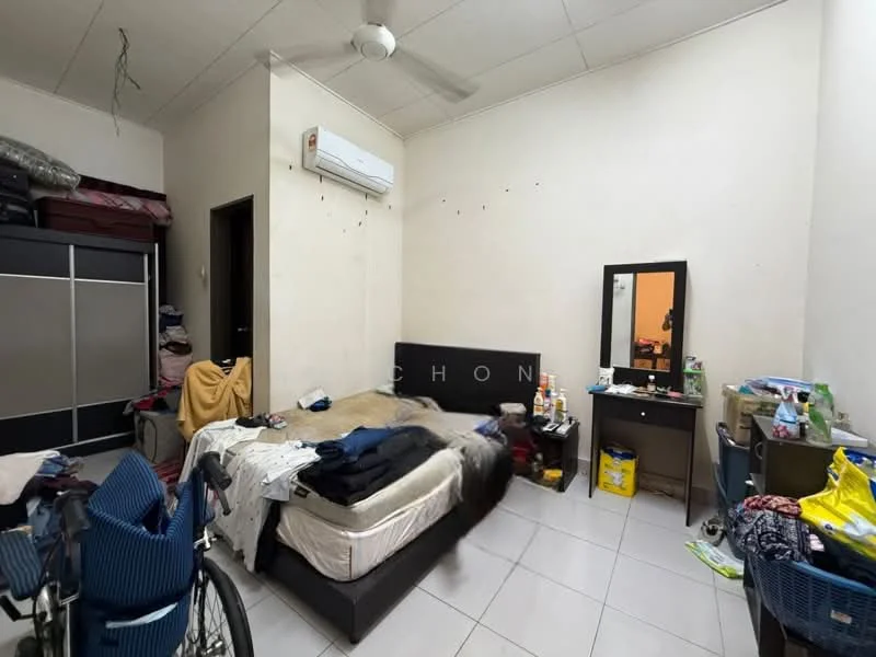 Bedroom features: queen-size bed with mattress, wall-mounted split AC, mirror on dresser, white painted walls, tiled flooring, ceiling fan, built-in wardrobe, cluttered with personal items, bicycle, laundry basket.