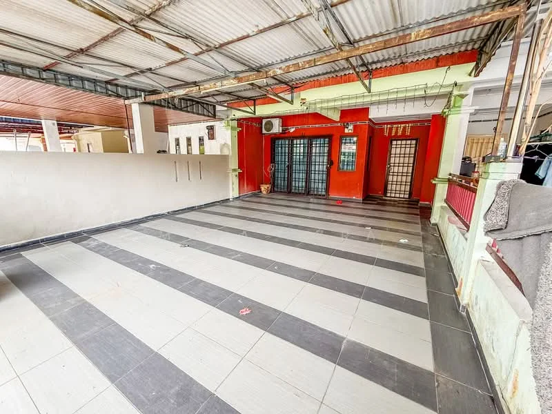 Room features: grey and white tiled flooring, exposed metal roof, red painted walls, black framed glass doors, air conditioning unit, green painted columns, open layout, no visible furniture; style: modern.