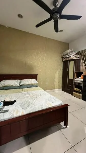 Bedroom features: queen-size bed with wooden frame, cream bed linens, gold accent wall, white tiled flooring, ceiling fan, built-in wardrobe with mirrored doors, stacked bedding on top of wardrobe, decorative pillows on bed.