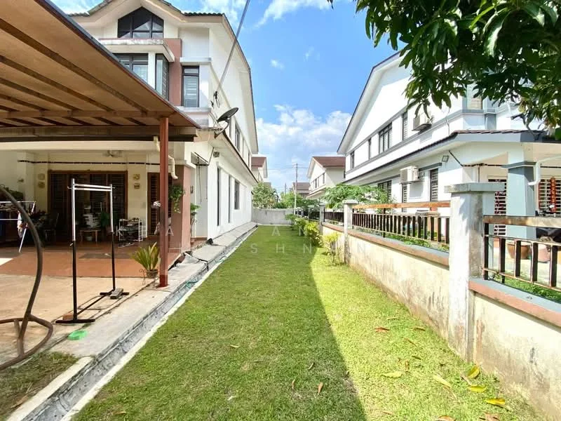 Exterior type: linked terrace house; features: manicured lawn, paved walkway, covered porch with swing, white painted facade, two-storey building, surrounded by greenery, fenced perimeter, satellite dish on roof, windows with grills; style: modern.