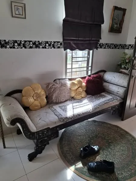 Living features: sofa with ornate wooden legs, cream upholstery, decorative throw pillows in gold and burgundy, round area rug, white tiled flooring, window with sheer curtains, blackout curtains, wall-mounted artwork, decorative wall trim; style: traditional.