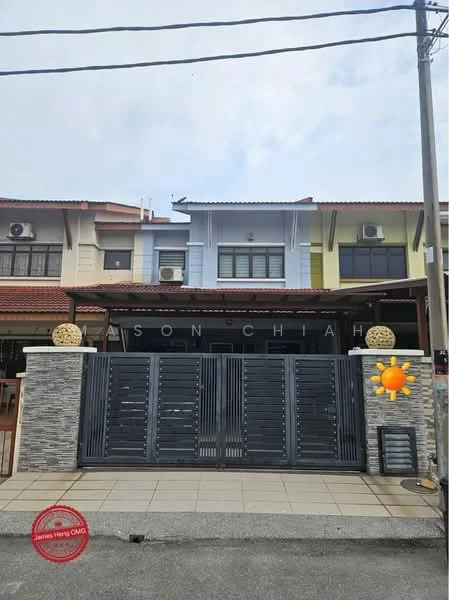 Exterior type: linked terrace house; features: two-storey building, grey stone cladding at the base, metal gate with horizontal slats, front porch with tiled flooring, multiple air conditioning units visible, gabled roof, decorative stone planters at the entrance, residential street view, overcast sky; style: modern.