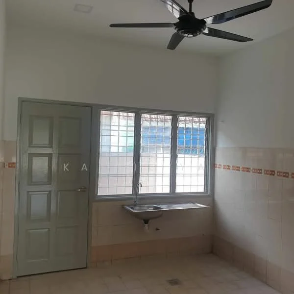 Laundry features: white painted walls, cream tiled walls, light beige tiled flooring, single-bowl stainless-steel sink, window with grid pattern, door with green paint, ceiling fan, wall-mounted faucet.
