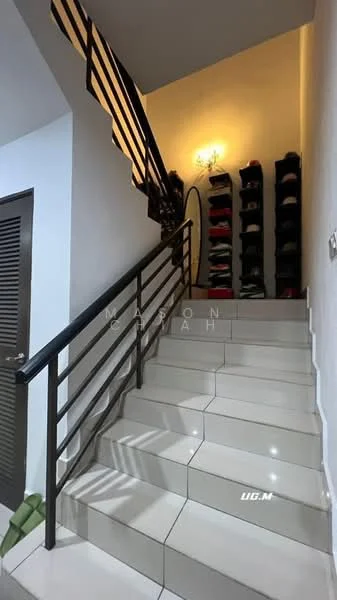 Room features: staircase with metal railing, white walls, tile flooring, decorative light fixture, shoe rack with multiple shelves, green plant at base of stairs; style: modern.