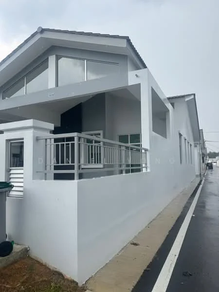Exterior type: semi-detached house; features: white painted facade, flat roof, large windows, balcony with railing, concrete walkway, manicured lawn, surrounded by pavement, single-storey, modern architectural style; style: modern.