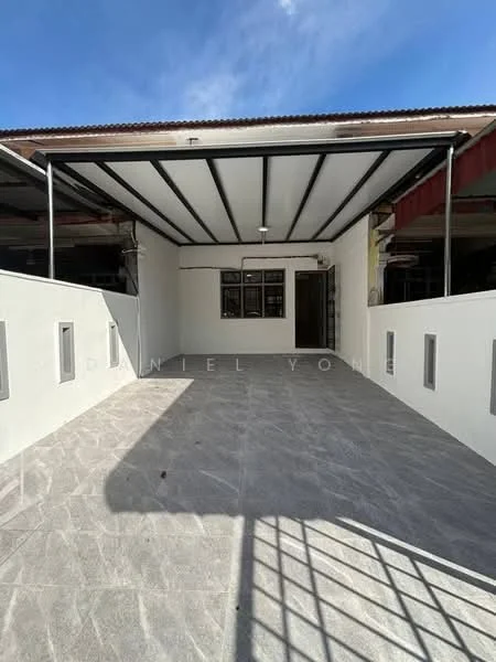 Exterior type: linked terrace house; features: covered car porch, grey tiled flooring, white painted walls, metal roof, large windows, open space, front garden area, concrete boundary wall; style: modern.