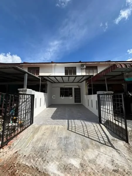 Exterior type: linked terrace house; features: white painted facade, metal gate, concrete driveway, covered porch area, sliding windows, roof overhang, exposed brick wall, front yard space, outdoor lighting, manicured landscaping, single-storey, surrounded by other residential buildings; style: modern.