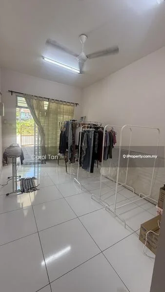 Room features: white painted walls, glossy white tile flooring, ceiling fan, large window with sheer curtains, clothes rack, folding table, open layout, natural light; style: modern; view: garden.