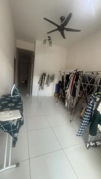 Laundry features: white painted walls, white tiled flooring, 5-blade ceiling fan, ironing board, clothes rack with hanging clothes, open space, natural light from window, no visible appliances.