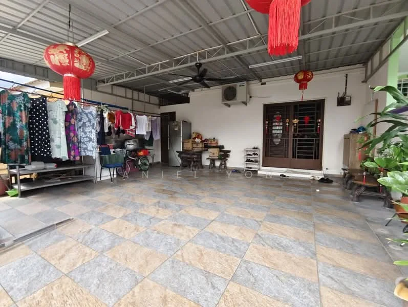 Room features: grey and beige patterned floor tiles, metal roof, ceiling fan, wooden door with glass panels, decorative red lanterns, open layout, various potted plants, clothes hanging on a rack, refrigerator, wooden furniture, wall-mounted air conditioning unit; style: traditional; view: garden.