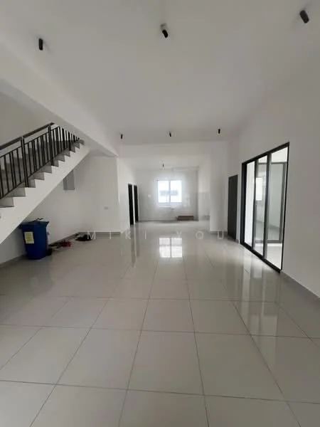 Room features: white painted walls, polished ceramic tile flooring, recessed LED downlights, staircase with metal railing, large windows, open layout, high ceiling, corner window, utility area with blue trash bin; style: modern.