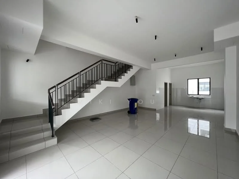 Room features: white painted walls, polished ceramic tile flooring, staircase with metal railing, recessed downlights, large window, open layout, corner area for table, blue recycling bin; style: modern.