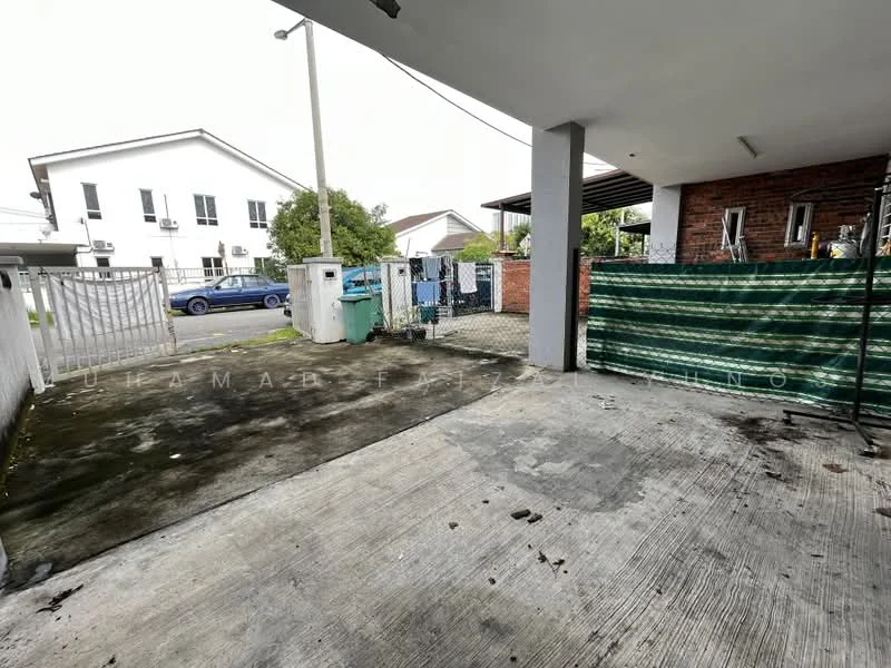 Exterior features: concrete flooring, fenced perimeter, gate at entrance, green garbage bin, paved driveway, adjacent residential buildings, overhead lighting, covered area; style: modern.