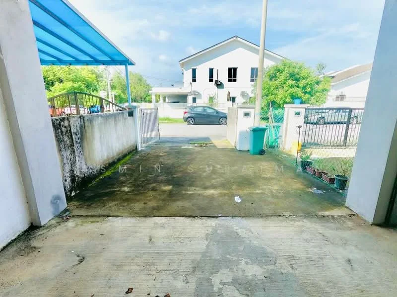 Exterior type: linked terrace house; features: concrete driveway, white painted facade, blue awning, manicured lawn, surrounded by greenery, fenced perimeter, visible car parked on street; style: modern.