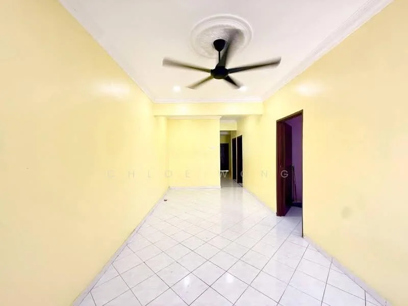 Room features: yellow painted walls, white ceiling with crown moulding, 5-blade ceiling fan, white tiled flooring, open layout, doorway leading to other rooms, natural light from adjacent rooms; style: modern.