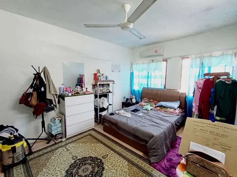 Bedroom features: queen-size bed, upholstered headboard, bedside lamps, dressing table with mirror, white painted walls, ceiling fan, area rug with geometric pattern, curtains, built-in wardrobe, clothing rack, decorative items on dresser, window with natural light.