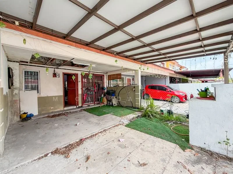 Exterior type: linked terrace house; features: covered car porch, red sedan car, artificial grass flooring, concrete flooring, exposed beams on ceiling, manicured garden area, front entrance with security gate, wall-mounted outdoor lighting; style: modern.