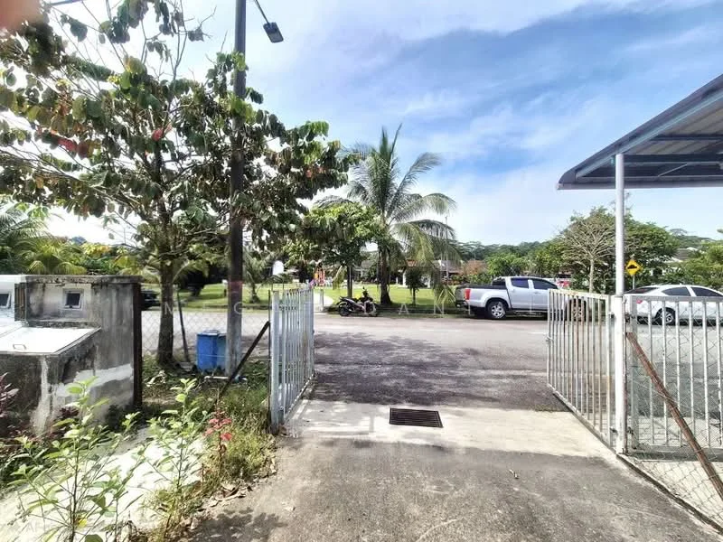 Exterior features: metal gate, concrete driveway, manicured lawn, palm trees, surrounding greenery, open parking area, fenced perimeter, street lighting; style: modern.