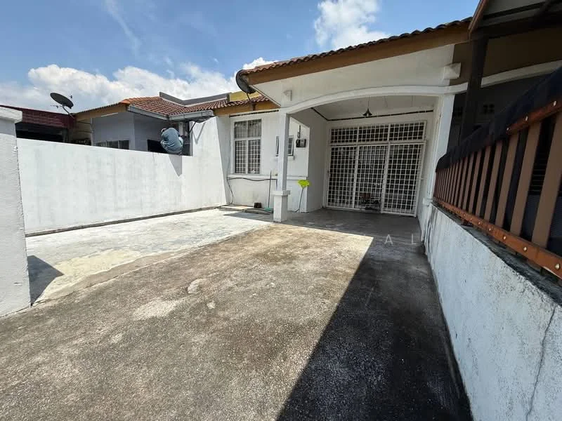 Exterior type: semi-detached house; features: paved driveway, white painted walls, roof overhang, metal grilles on windows, outdoor space, satellite dish, fenced perimeter, concrete flooring, garden area, single-storey, clear blue sky; style: modern.