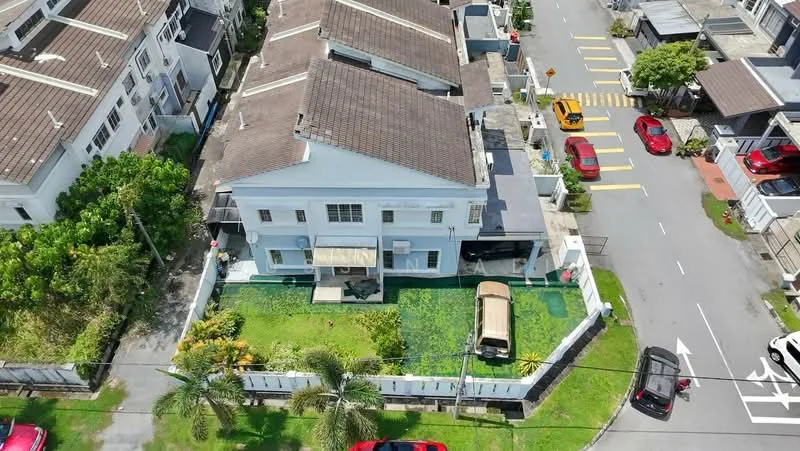 Exterior type: linked terrace house; features: two-storey building, white painted facade, pitched tile roof, manicured lawn, garden area, driveway with carport, surrounded by greenery, adjacent to residential street, visible parking spaces, multiple vehicles parked, fenced perimeter; style: modern.