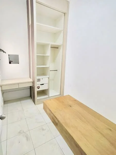 Room features: white painted walls, light-colored wood cabinetry, built-in shelving, drawer unit with handle, wooden bench, ceramic tile flooring, mirror on wall, hanging rod for clothes; style: modern.