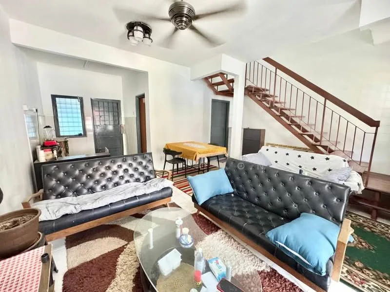 Living features: 2 black leather sofas, glass coffee table, area rug with geometric pattern, ceiling fan with light, wooden staircase, white painted walls, wooden flooring, dining table with chairs, decorative wall art, window with grid pattern, potted plant; style: modern.