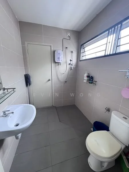 Bathroom features: grey tiled walls, light grey tiled flooring, single-sink vanity with mirror, chrome basin mixer faucet, toilet, shower area with handheld shower, water heater, window for natural light, shelf with toiletries; style: modern.