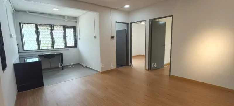 Room features: laminate flooring, white painted walls, ceiling lights, window with metal grille, doorway leading to another room, desk area, neutral color scheme, open layout; style: modern.