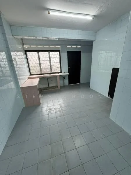 Room features: light blue tiled walls, grey tiled flooring, large window with grid pattern, black door, built-in countertop, open space layout, fluorescent ceiling light.