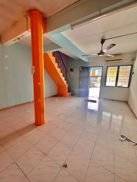 Room features: orange painted column, light blue painted walls, white ceiling, ceiling fan, tiled flooring, staircase with black railing, large windows, door leading outside, visible electrical outlets, open layout; style: modern.
