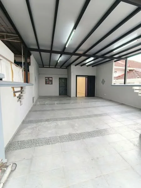 Room features: grey tiled flooring, white painted walls, black exposed beams on ceiling, large windows providing natural light, open layout, two doorways leading to other rooms, decorative wall panels, no visible furniture; style: modern.