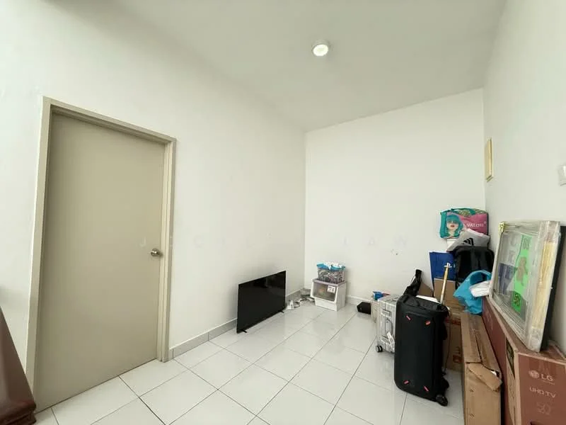 Room features: white painted walls, white tiled flooring, single door, ceiling light, TV console, boxes, luggage, cleaning supplies.